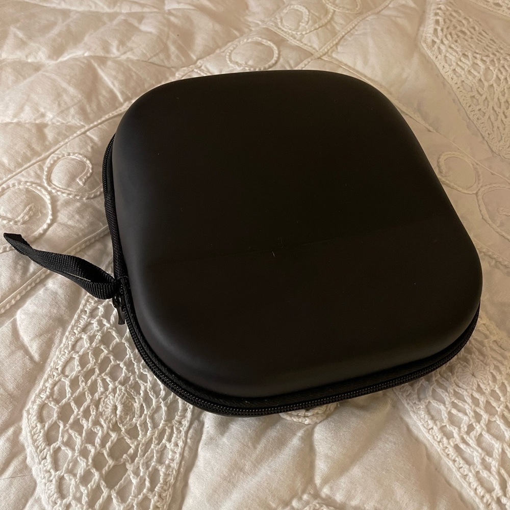 Headphone hard travel case. Black. Size 6 3/4”x 7 3/4”.